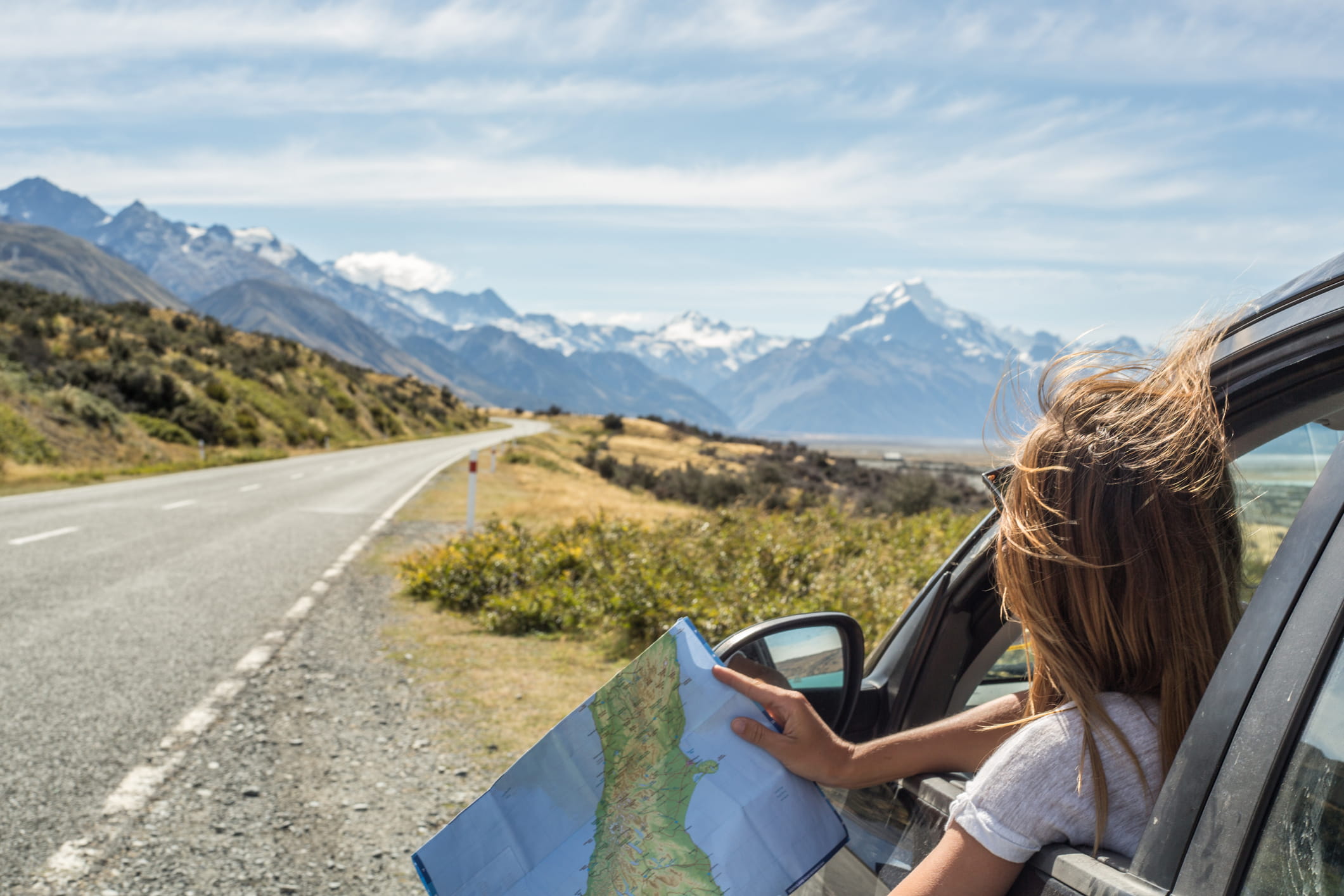 Road Trip with girl holding map